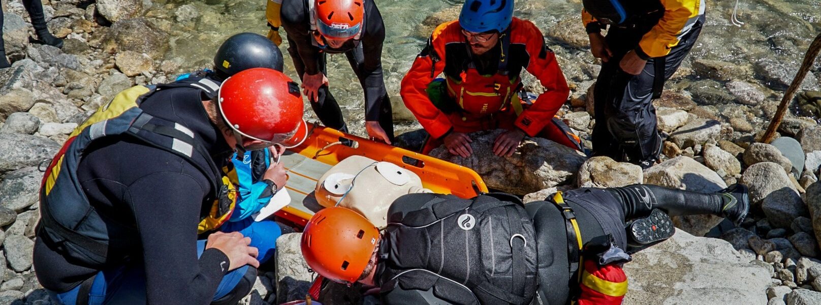 People respond to a river rescue and administer CPR